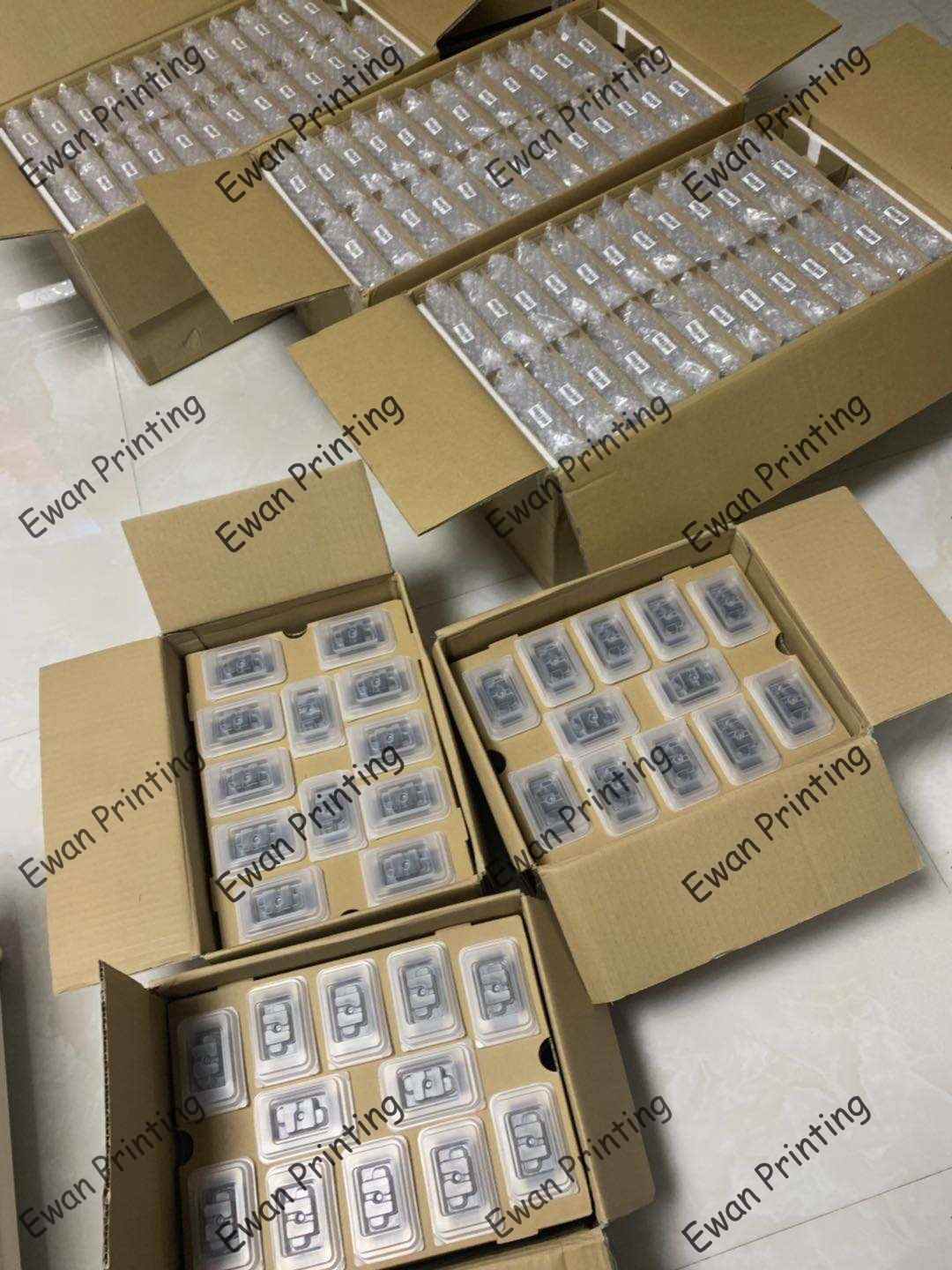 Multiple cardboard boxes filled with packaged items, neatly arranged and labeled, displaying a large number of individual products in plastic containers.